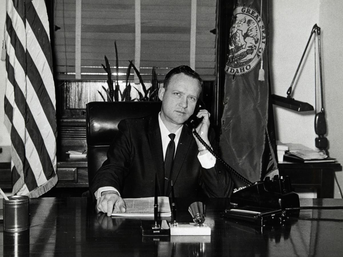 Jim McClure talking on the phone at his desk